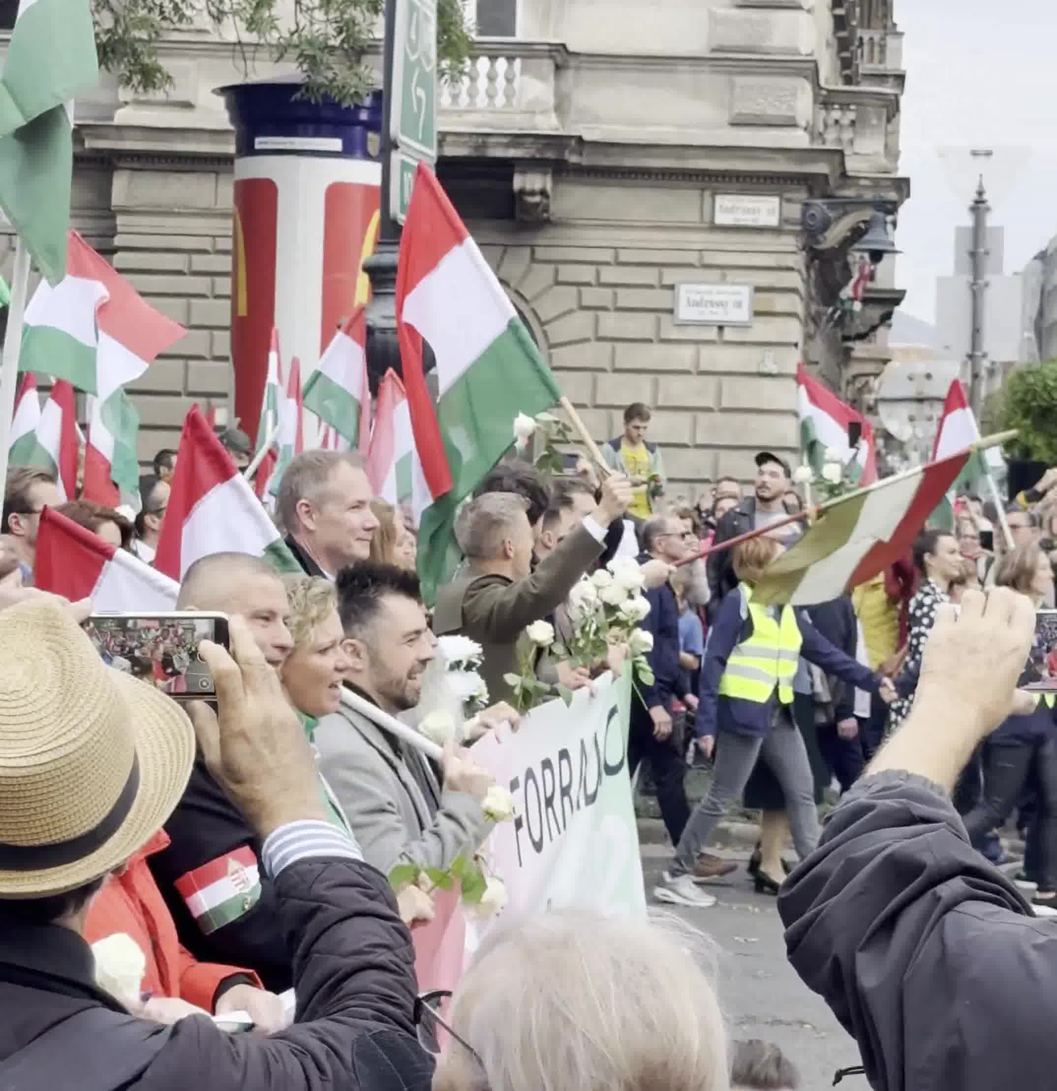 Budapest marks the anniversary of the 1956 anti-Soviet revolution with two major rallies. Orbán’s “peace march,” led by a banner reading “We won’t die for Ukraine,” has ended — now opposition leader Péter Magyar’s “national march” heads with supporters toward Heroes’ Square
